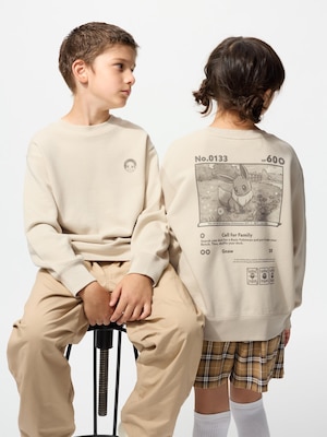 long sleeved beige sweatshirt with a small eevee icon on the front and a larger eevee illustration on the back.