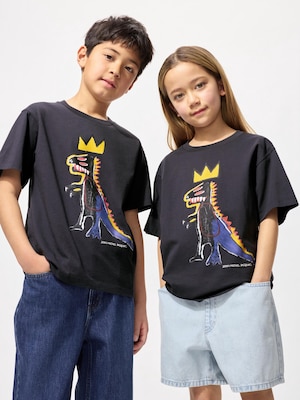 black tshirt with an illustration of a black and blue dinosaur wearing a crown.